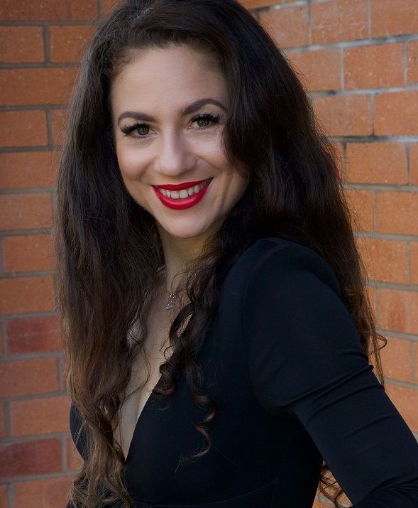 Marinna Psaltis, A smiling beautiful long haired lady wearing a black dress 
