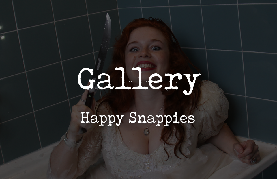 A red haired woman wearing a bridal dress in a bathub while holding a knife