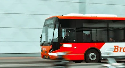 A moving bus in the road