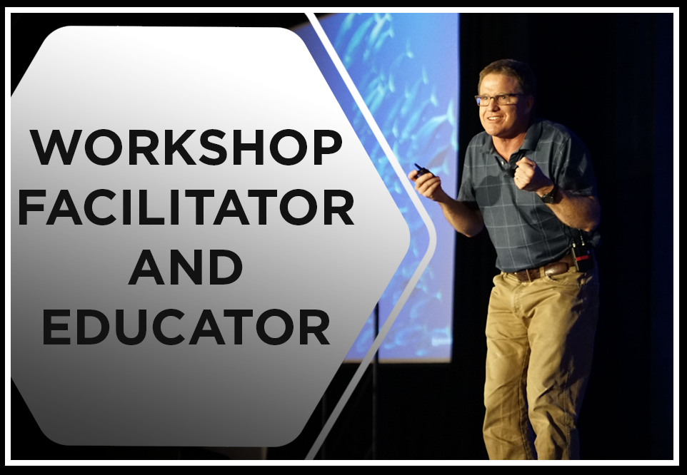 Preview of Workshop Facilitator and Educator featuring a facilitator on stage presenting and wearing a blue polo and khaki jeans