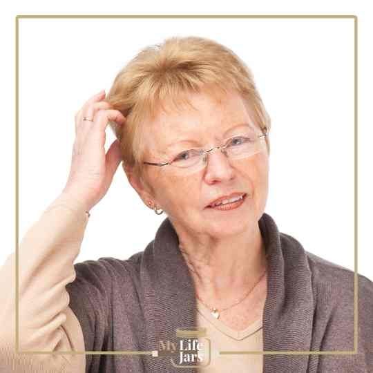 Older woman scratching head puzzled