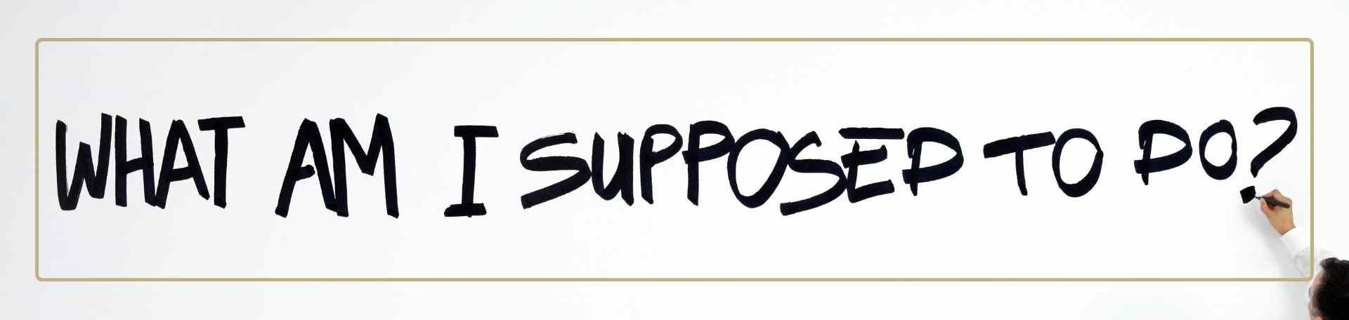 Handwritten sign saying What am I supposed to do