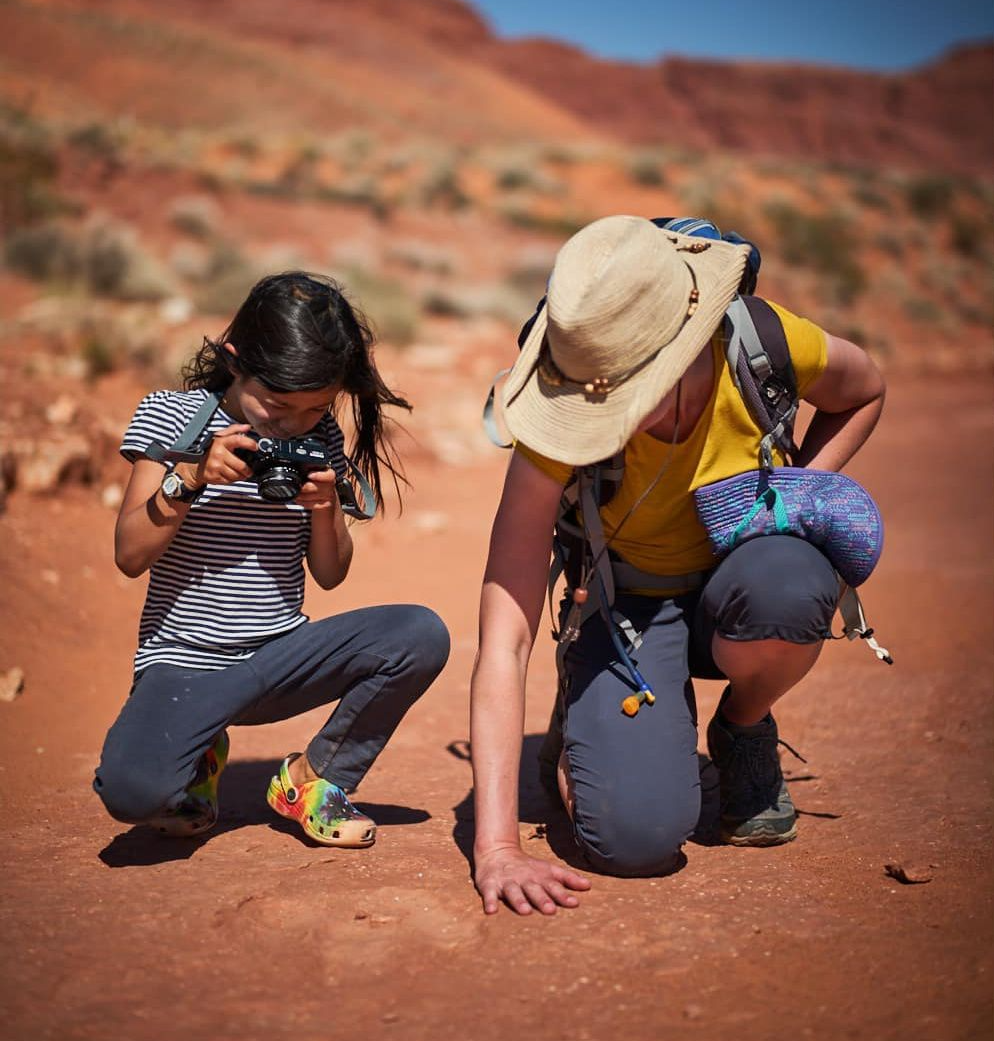 Jen Lumanlan and daughter Carys exploring photography together in a desert landscape