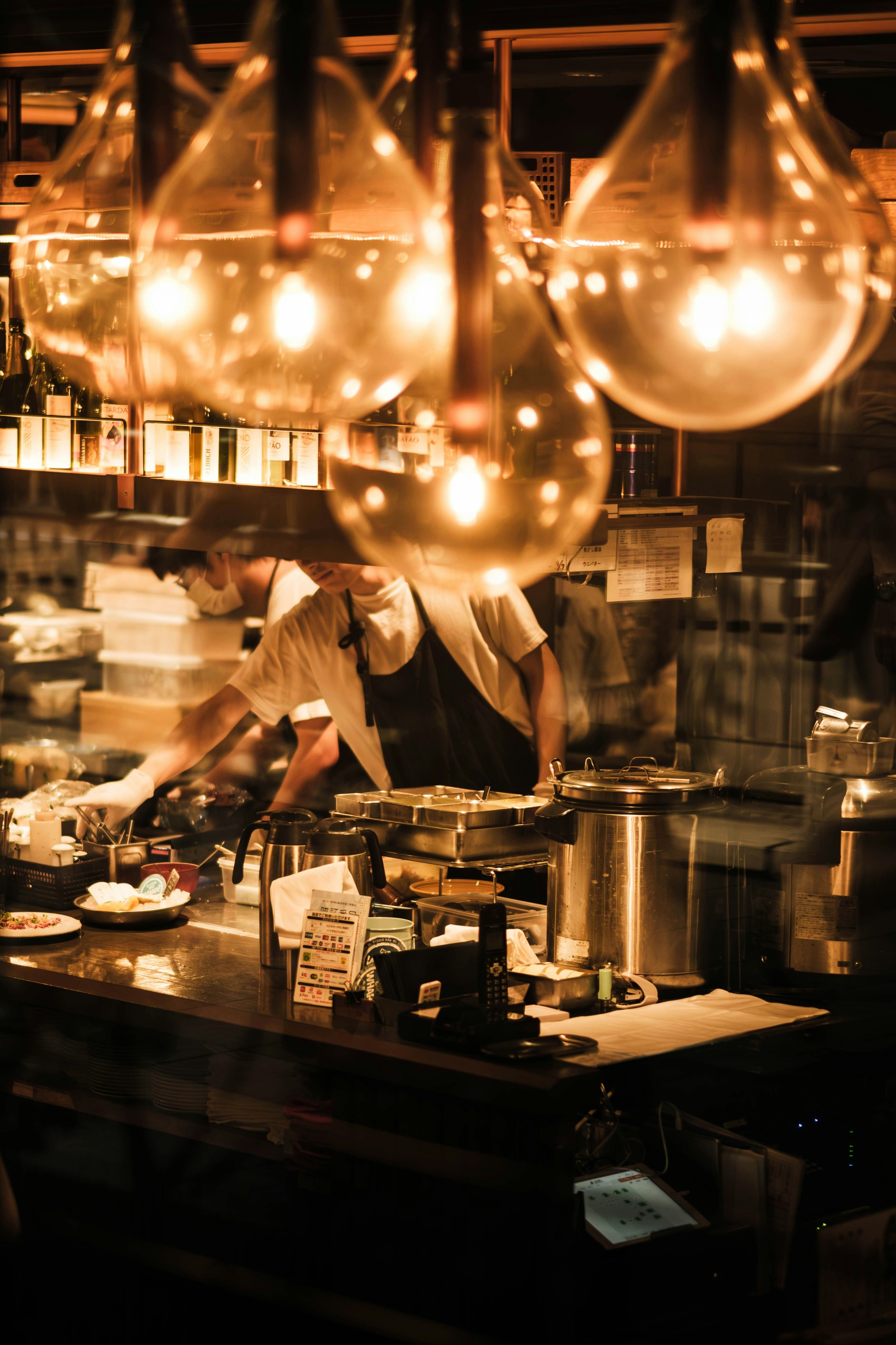 A cook working the pass mid-service