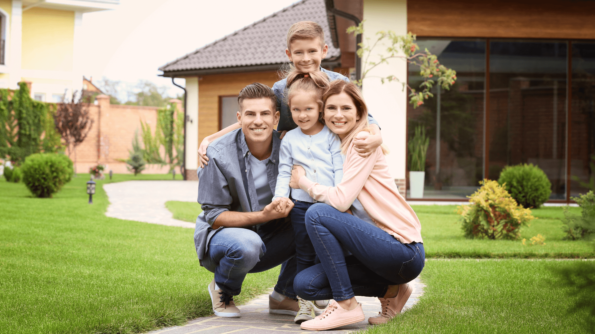 A happy family or individual in front of their investment property, representing the success stories featured in the case studies.