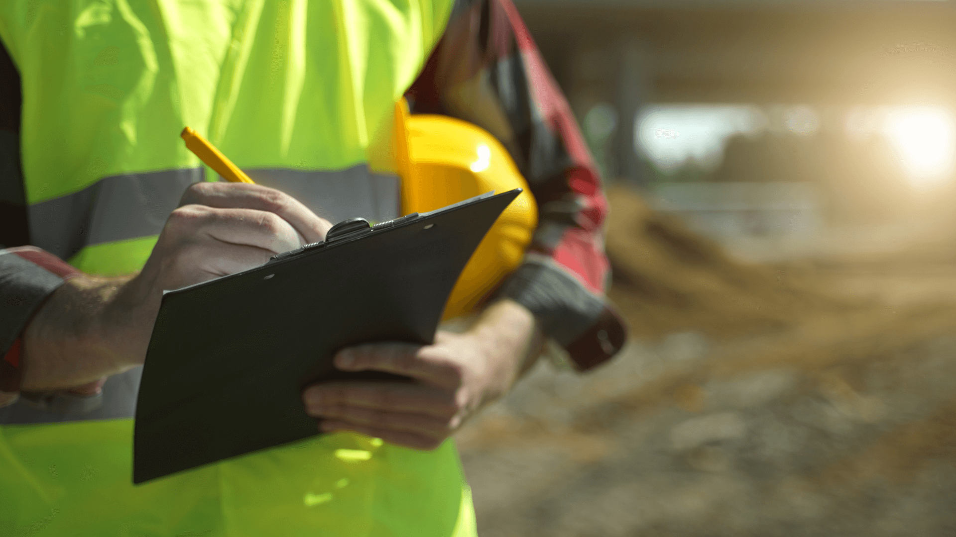 An inspector with a clipboard and hard hat inspecting the structure of a property, highlighting the crucial step of a Building and Pest Inspection.