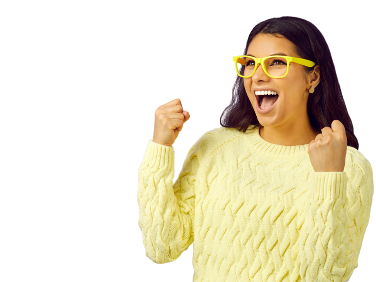 Woman in pastel yellow knitted jumper with summer yellow glasses holding her hands up, closed fists with excitement
