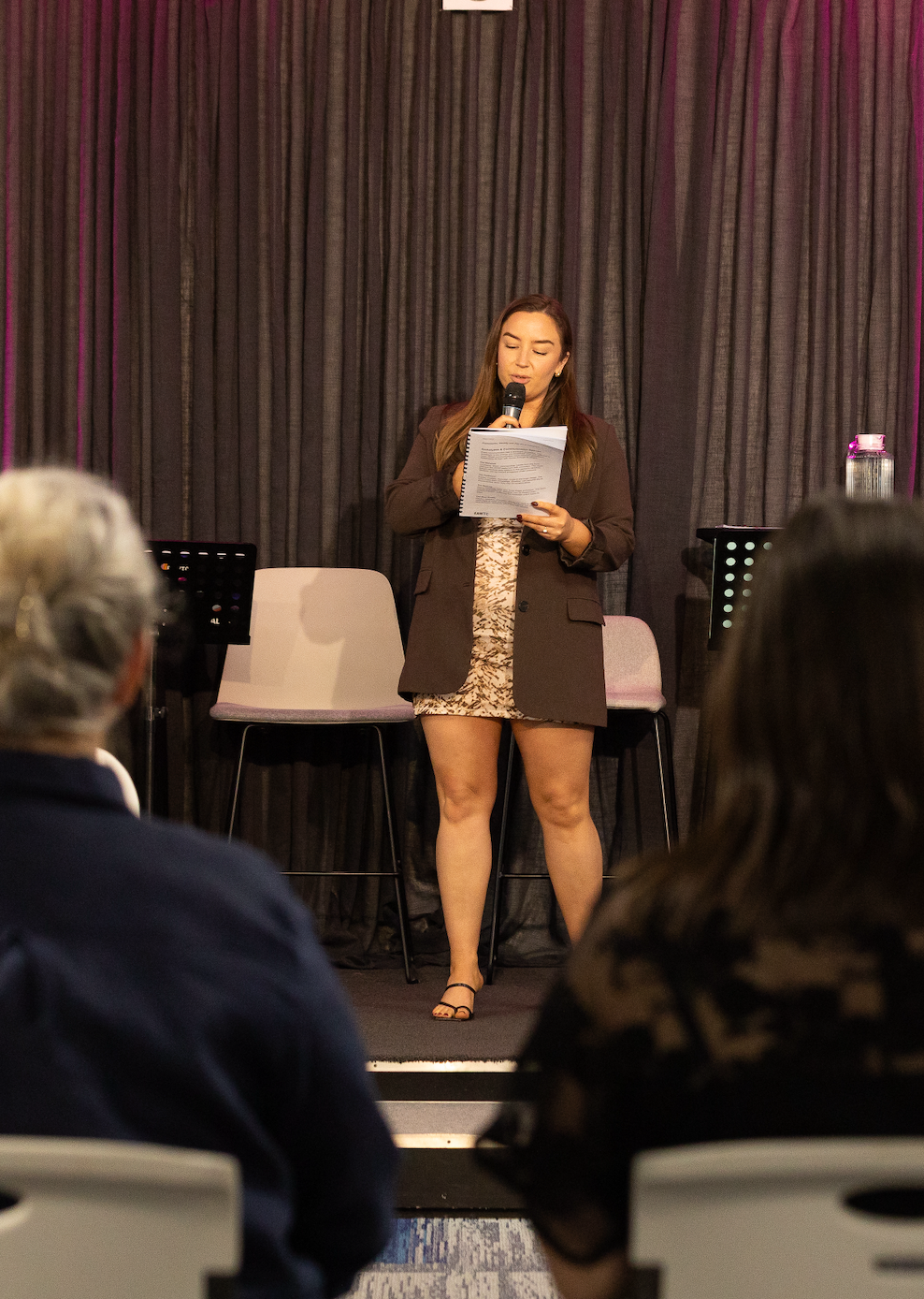 Elizabeth anne walker helping women on stage