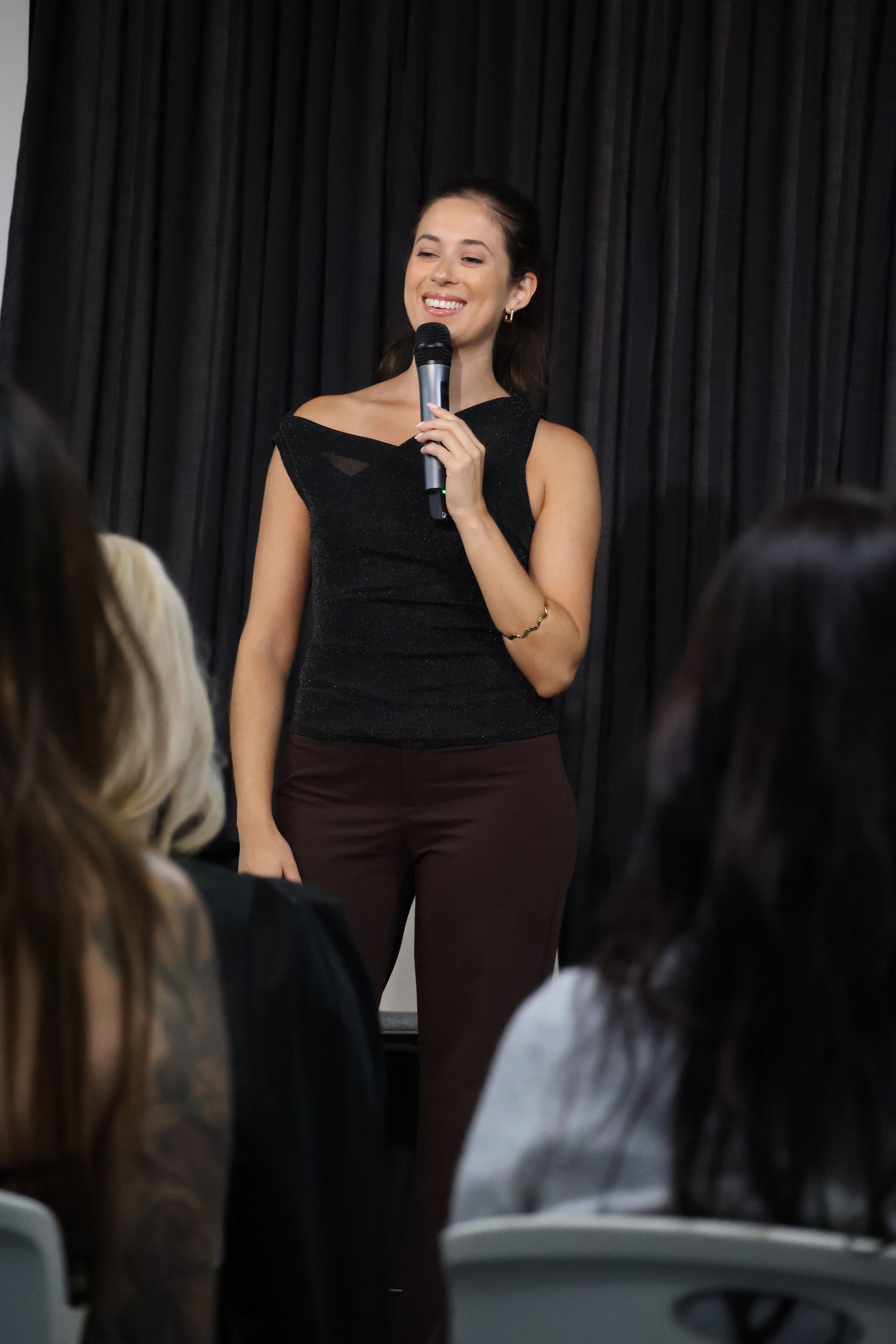 girl speaking onstage confidently