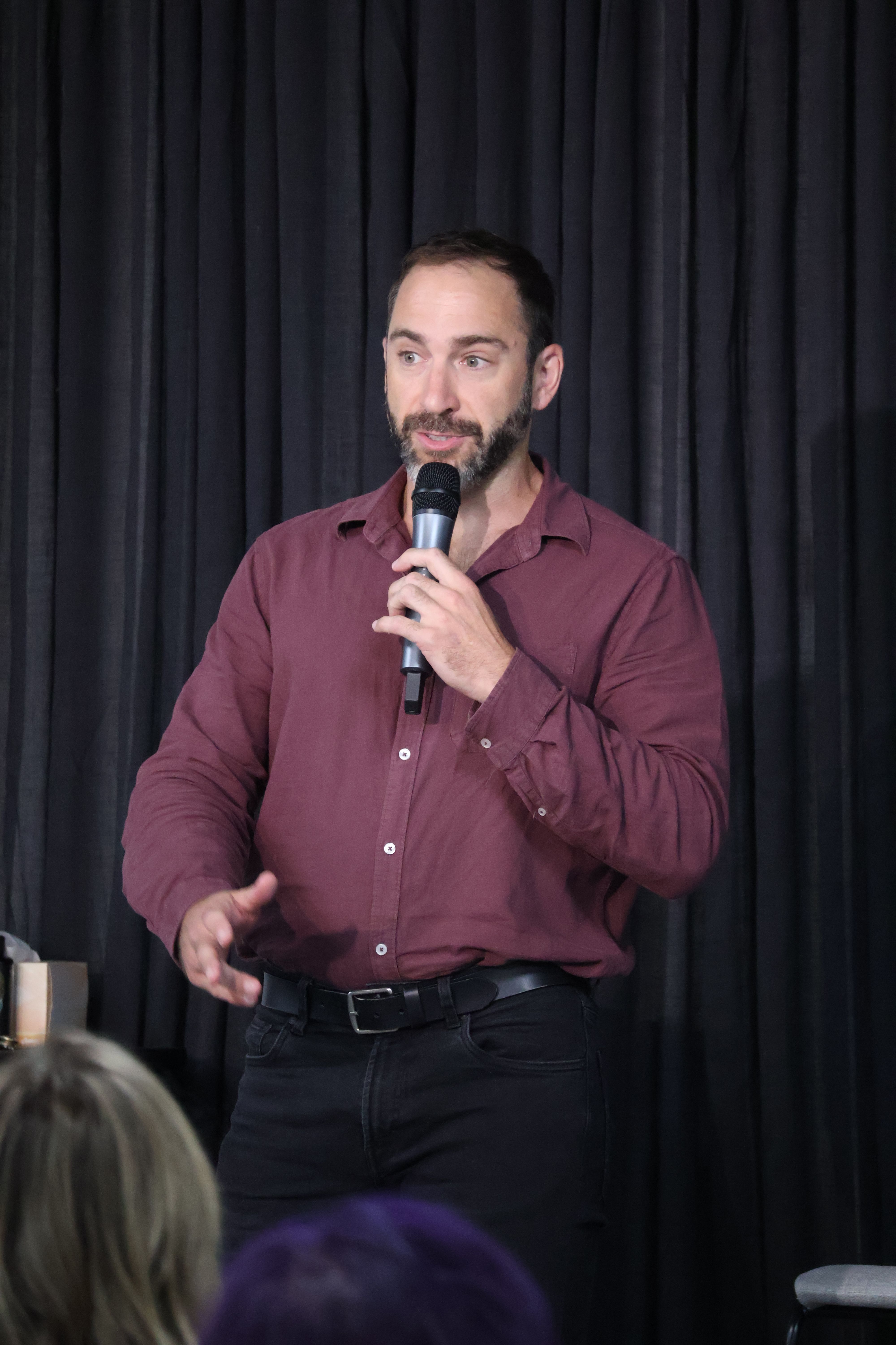 man speaking into microphone