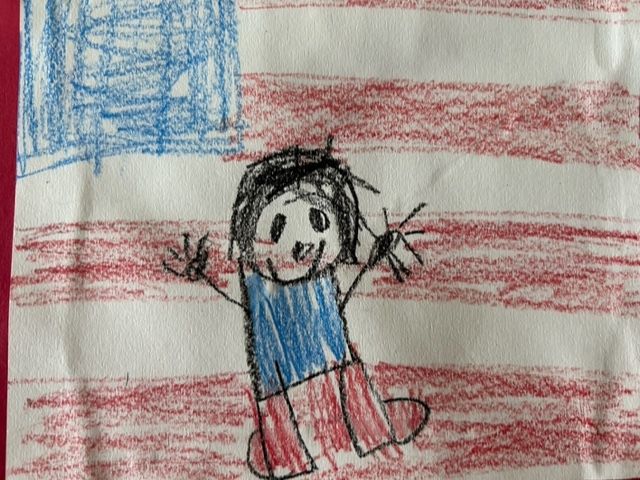 Drawing of a child in front of the American flag