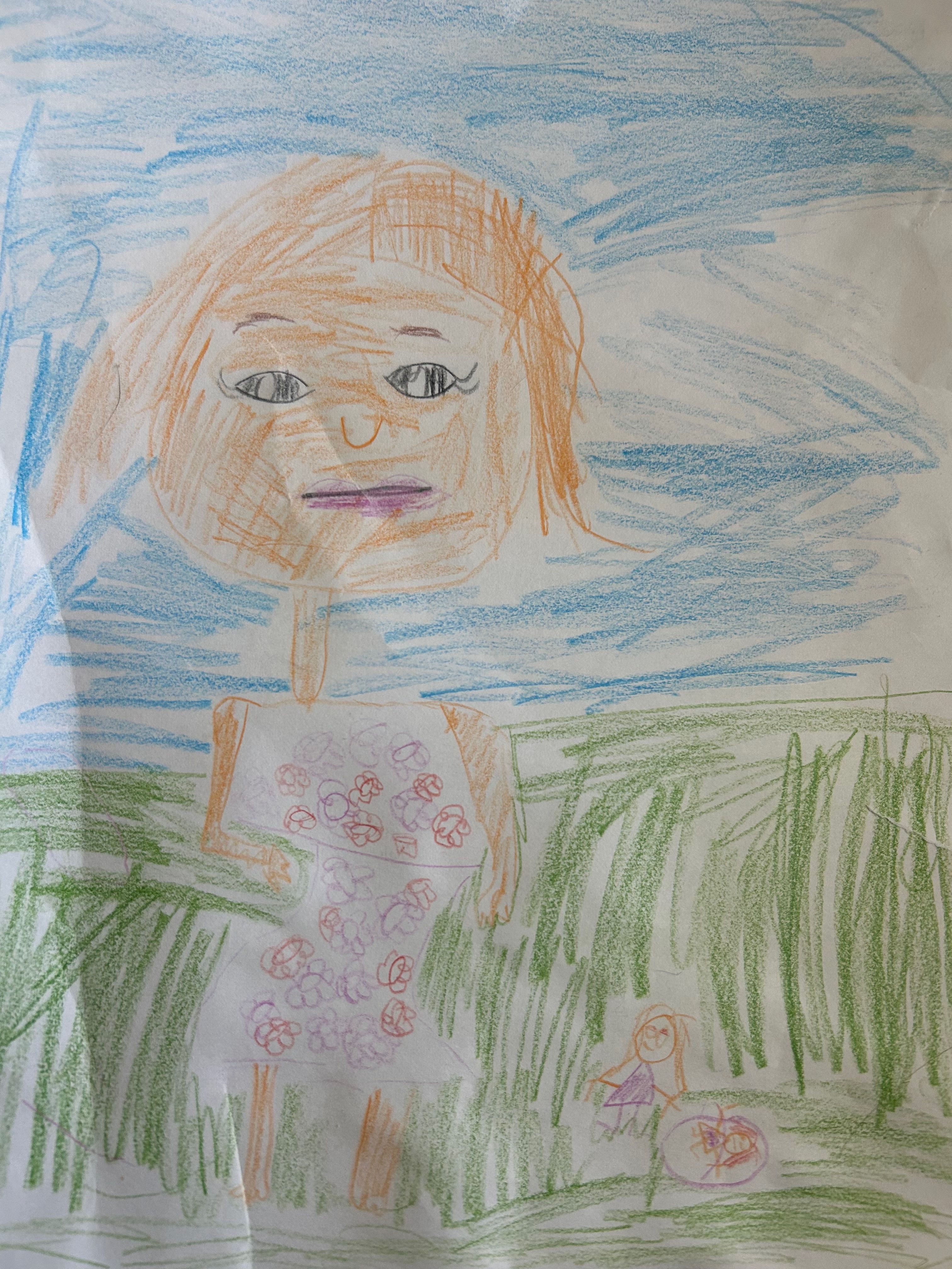 Drawing of a child on a grassy hill under the sun