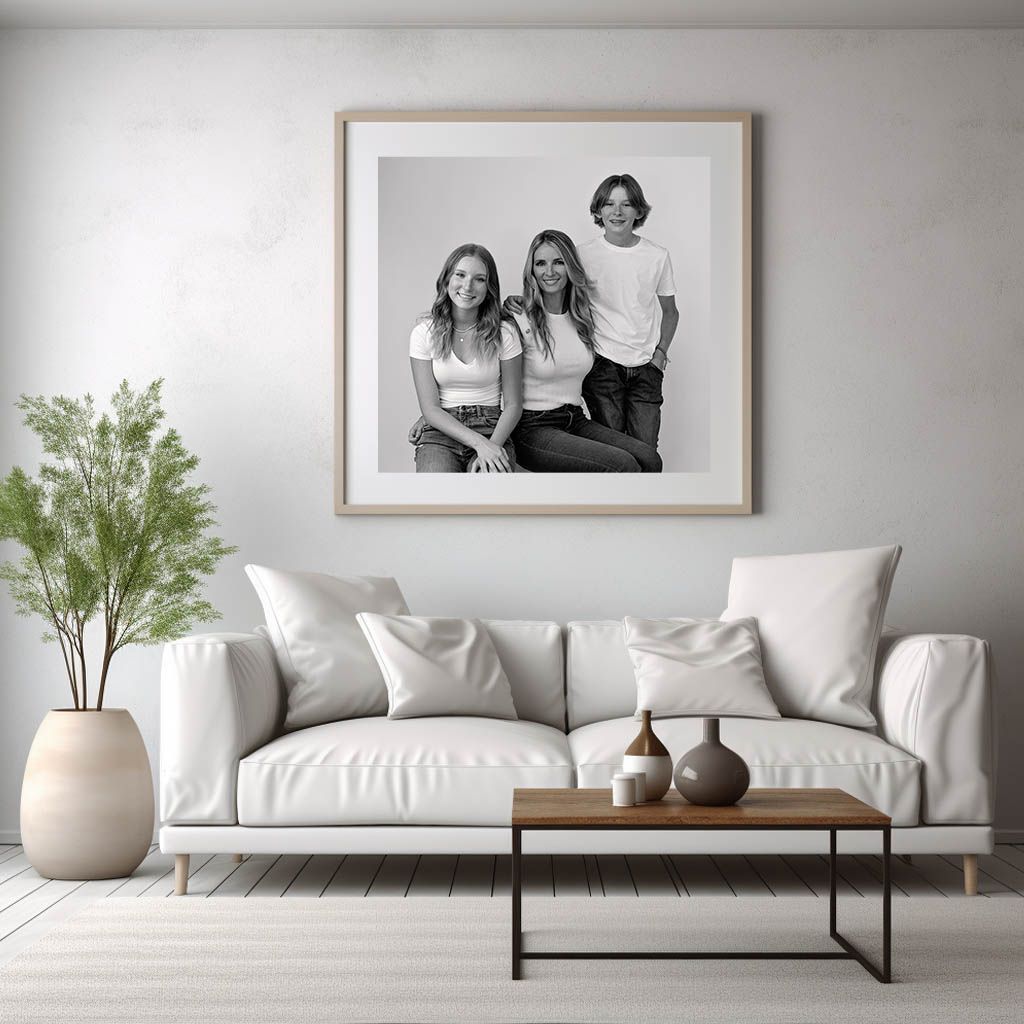 A family portrait frame hangs in white wall