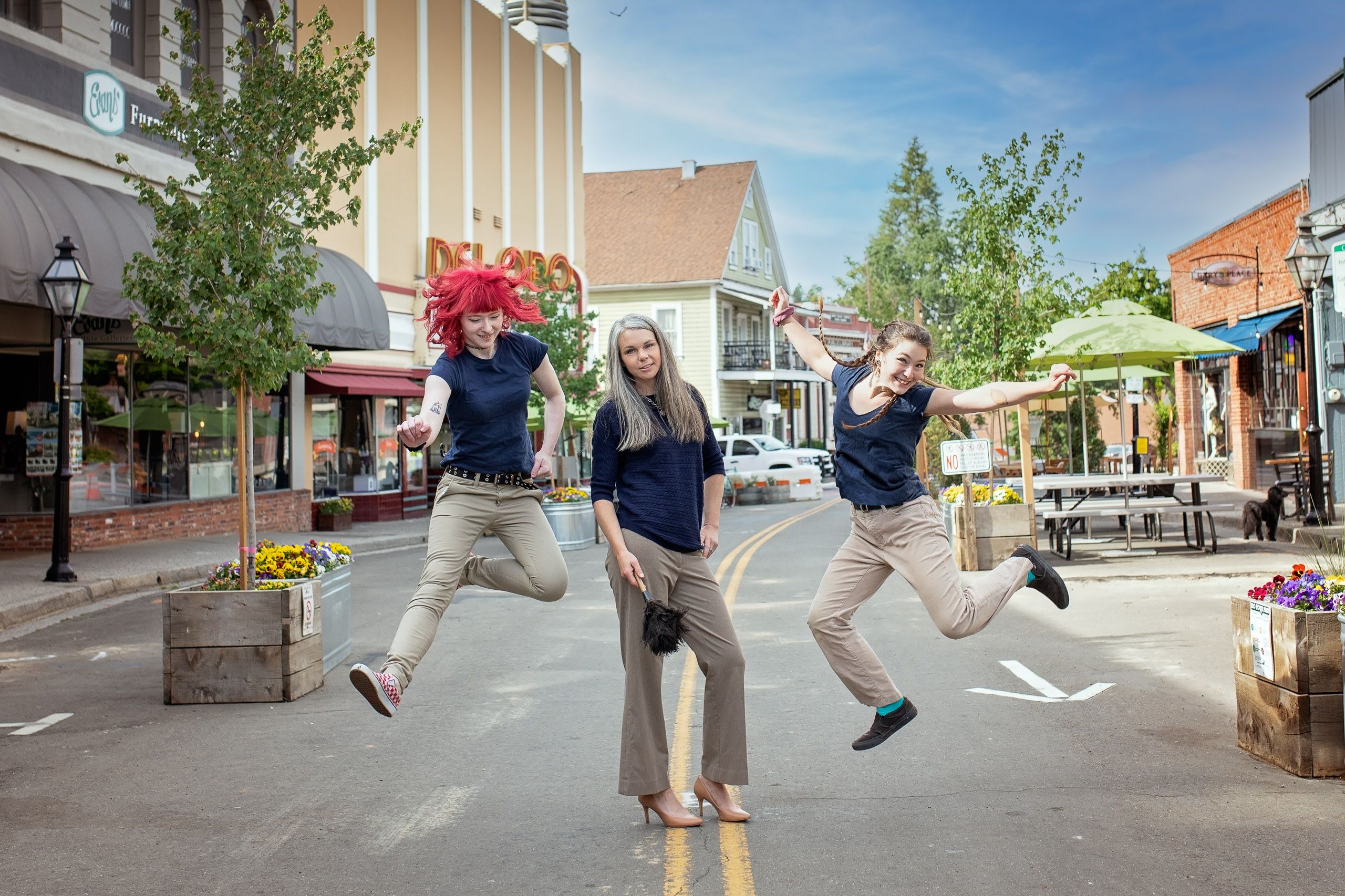 Artist surrounded by her artwork in a studio, captured for a personal branding project.