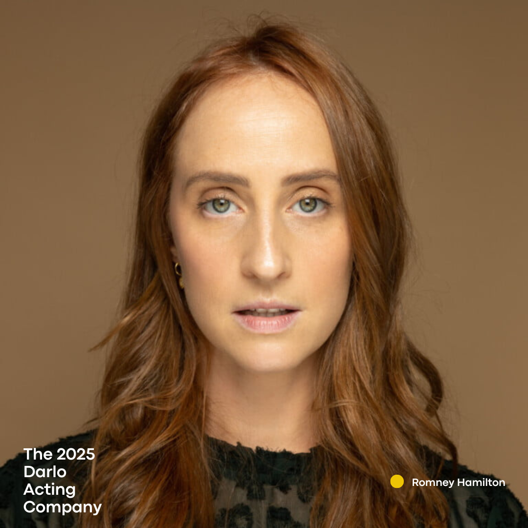 Romney Hamilton - A fierce lady with a long brown hair wearing a black patterned blouse