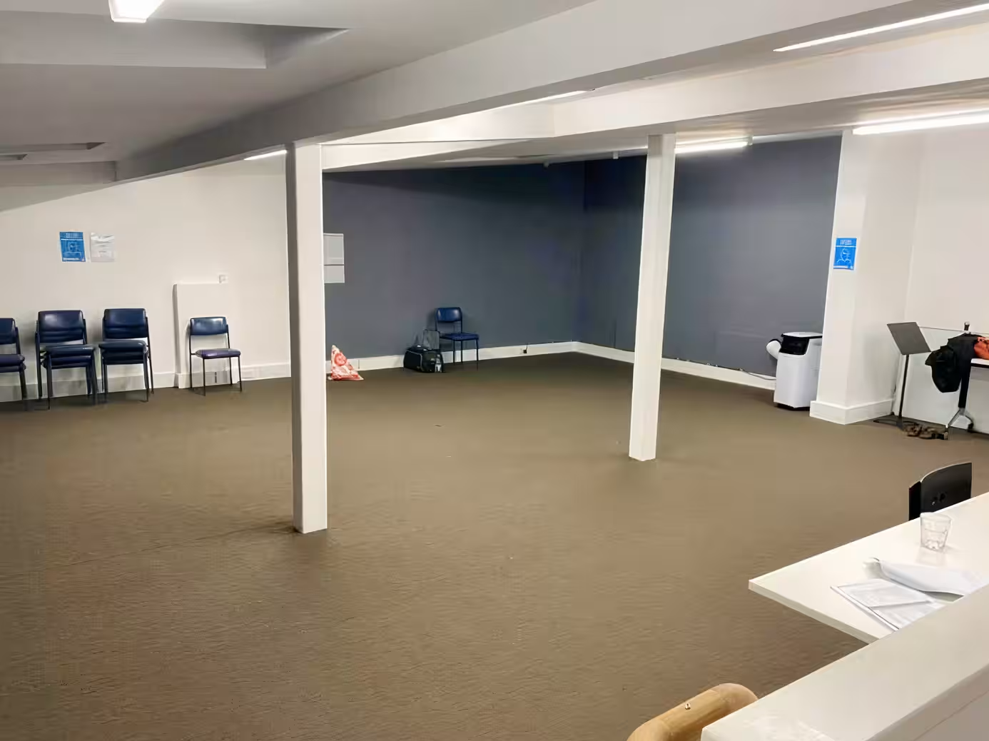 Spacious room with empty chairs and tables. Darlinghurst Venue hire
