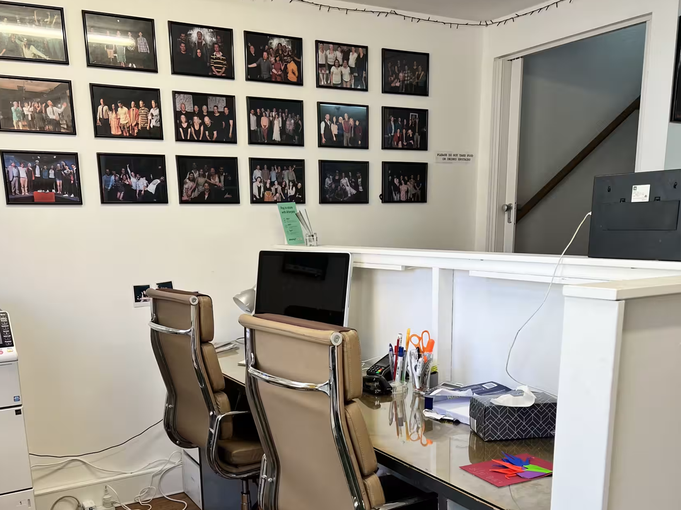 Interior of a room featuring a desk, chairs, and wall decorations. Darlinghurst Venue hire