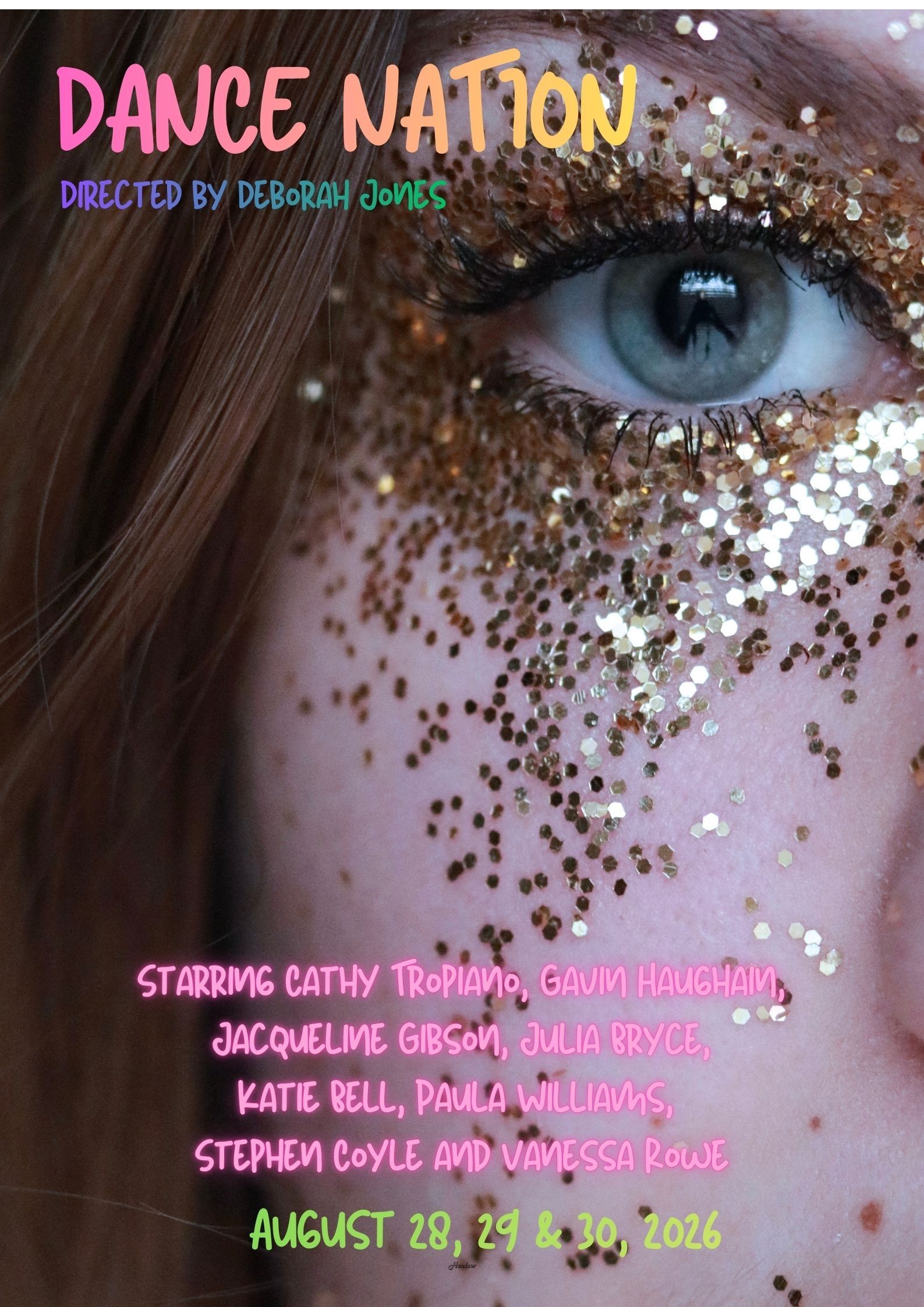 Girl with glitter on her face and coloured writing that says Dance Nation