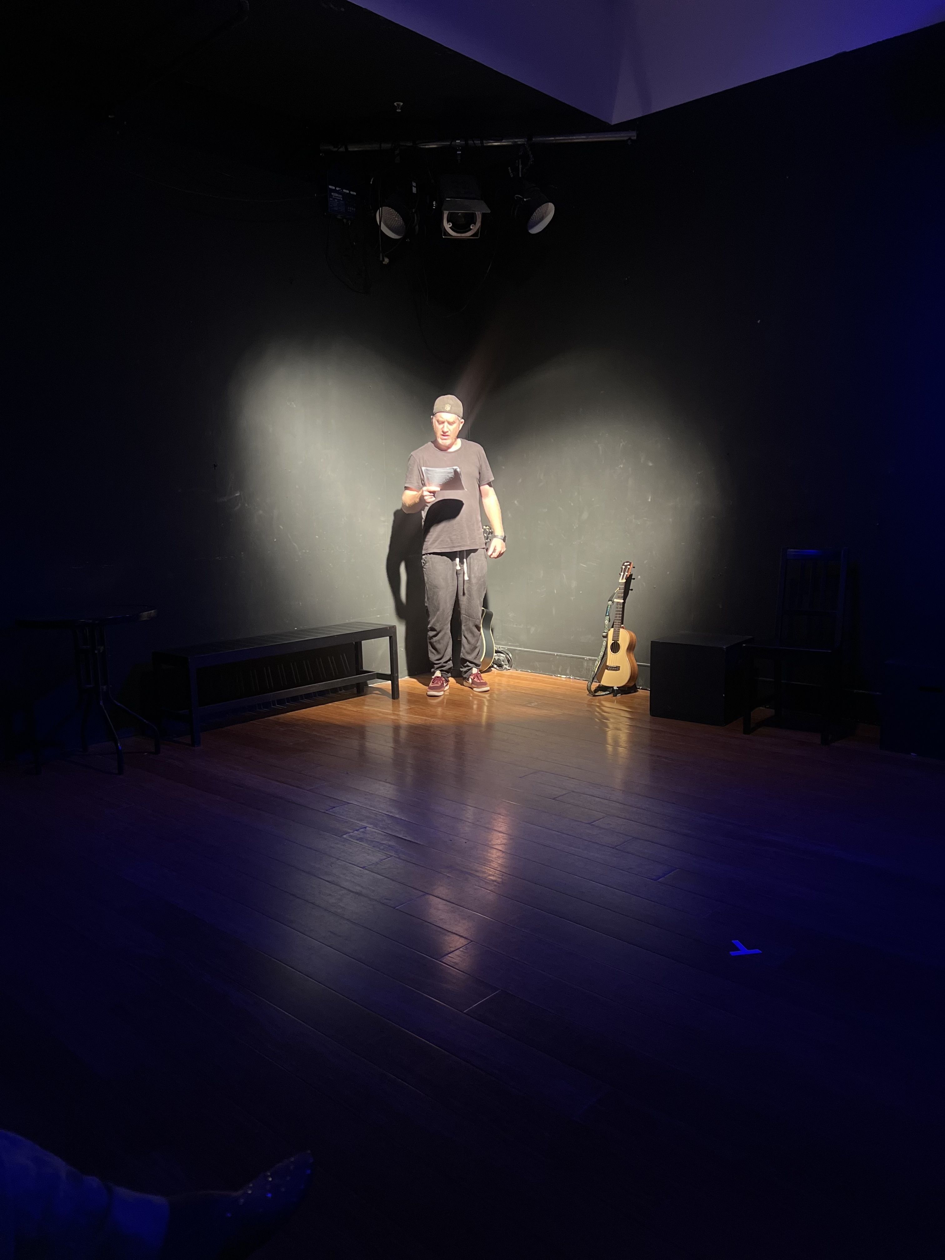 A woman holding a megaphone against a blue sky backdrop, conveying a powerful message.