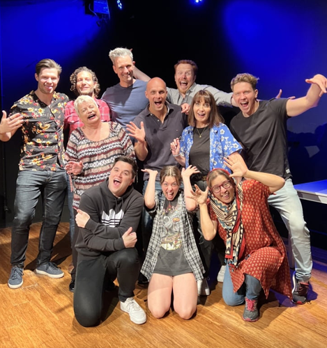 Acting students pose happily after their acting class performance