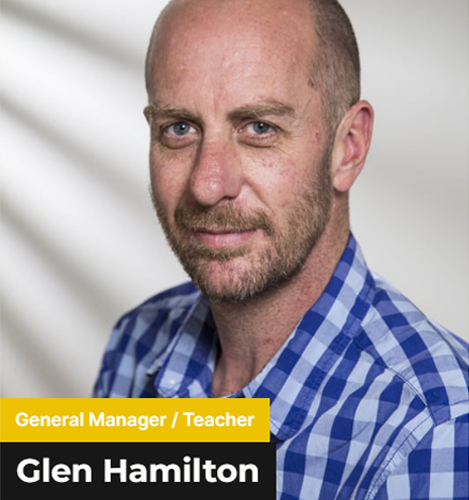 Glen Hamilton - Guy with brown shaved hair wearing a blue checkered polo