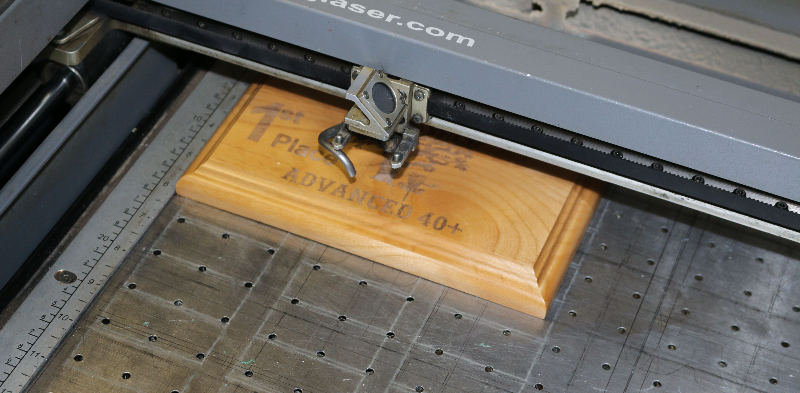 Close-up of laser engraving on a wooden surface