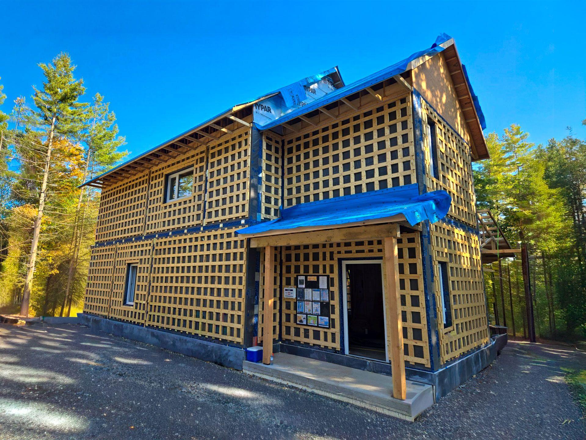 A two-storey Quantum home during construction, with the prefabricated panel envelope installed