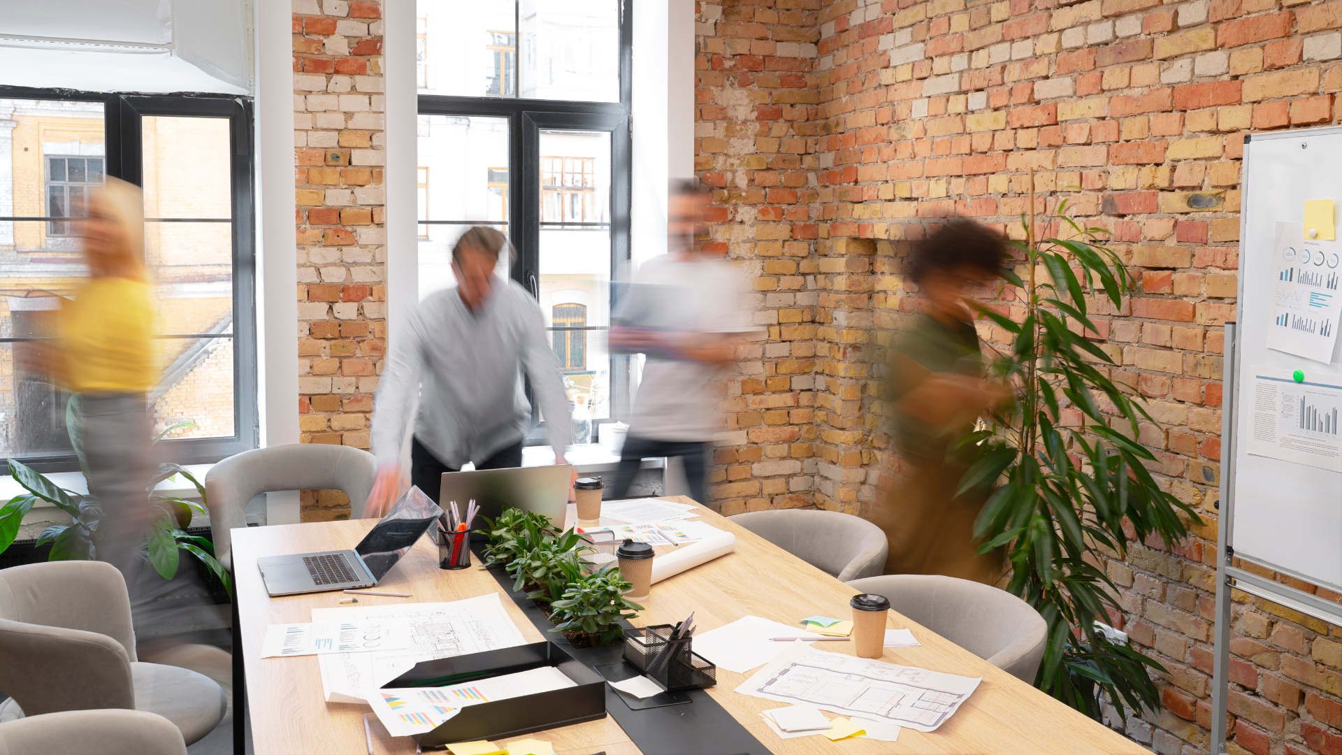 An image of people in a meeting roomhaving a meeting