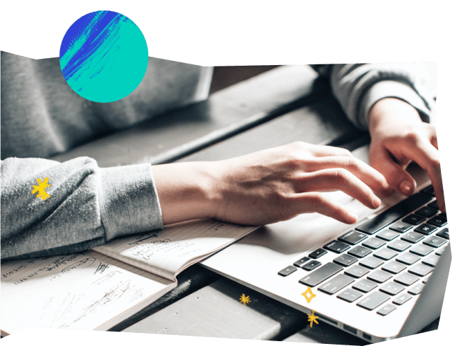 A person typing on a laptop computer