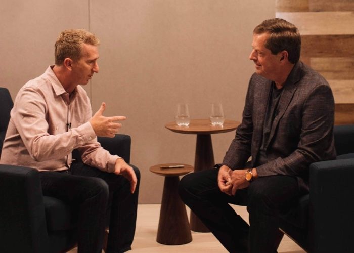 Ontraport's Founder and CEO Landon Ray (left) chatting with an entrepreneur