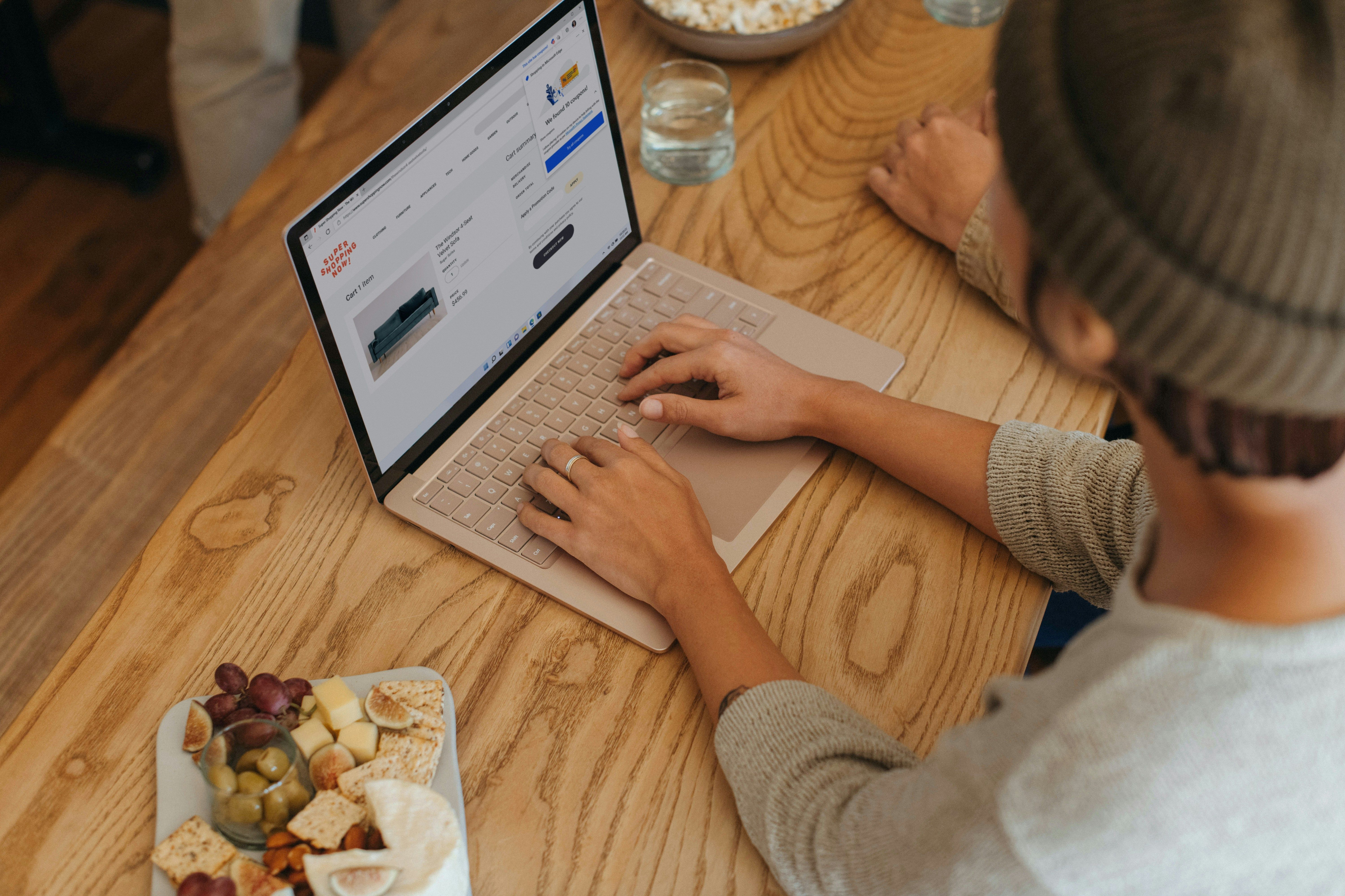 Person reading email on a laptop at home