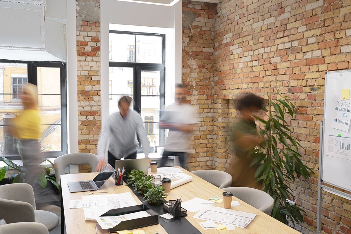 An image of people in a meeting roomhaving a meeting