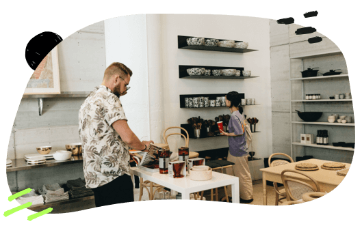 A man and woman browsing a modern home-goods store.
