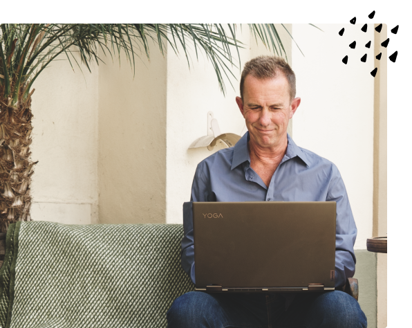Young entrepreneurs discussing business ideas at a table outside.