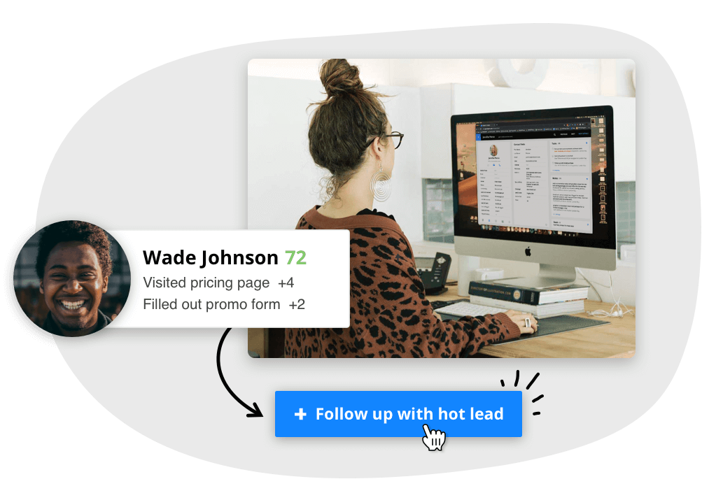 Picture of a woman sitting behind a computer with the computer showing contact records within a CRM database.