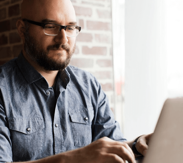 An Ontraport user working on a laptop computer