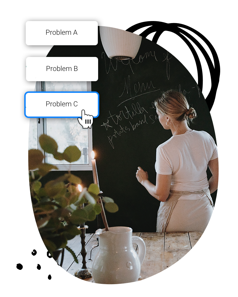 A woman writing on a chalkboard.