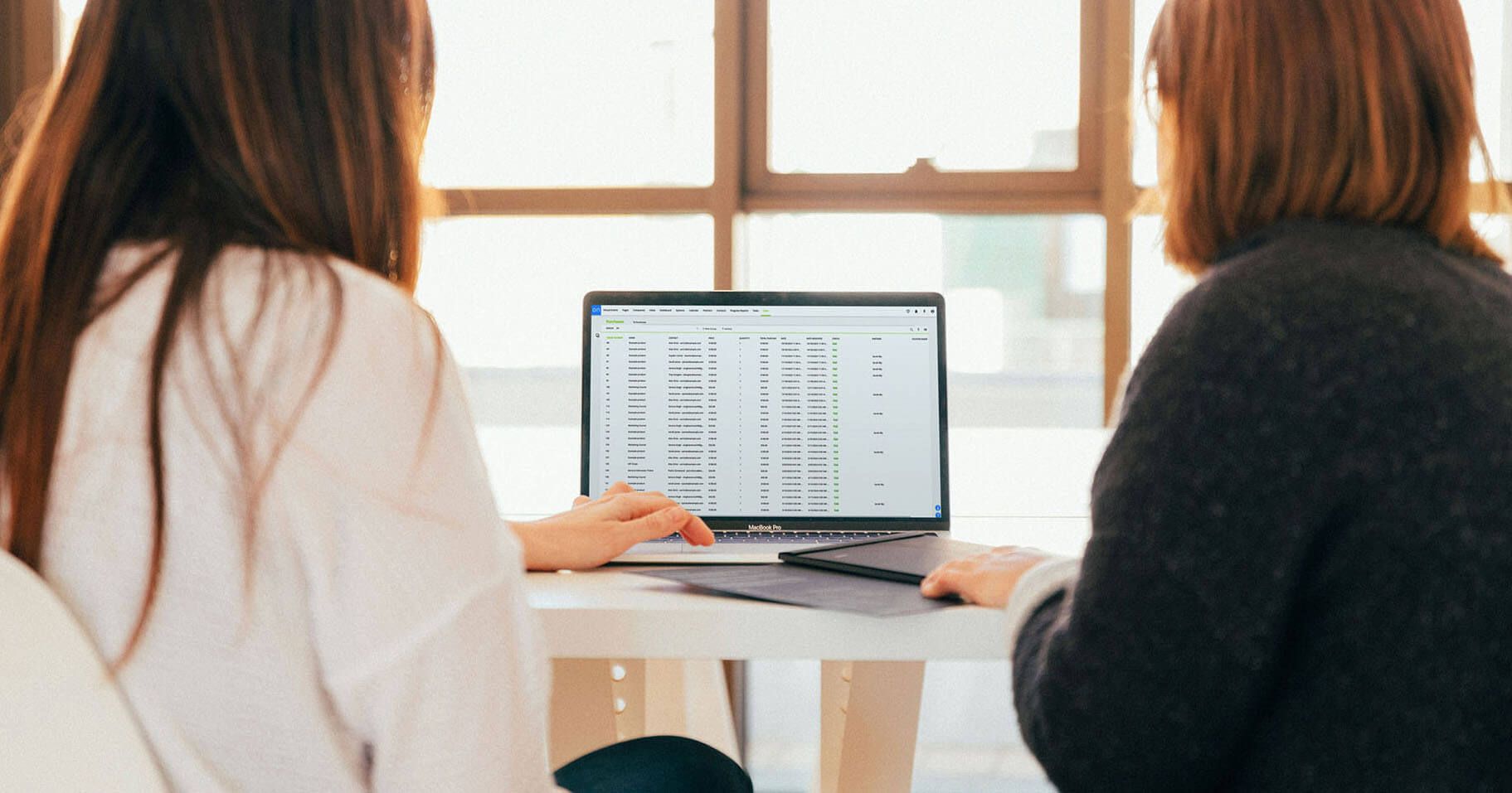 An image of people in a meeting roomhaving a meeting