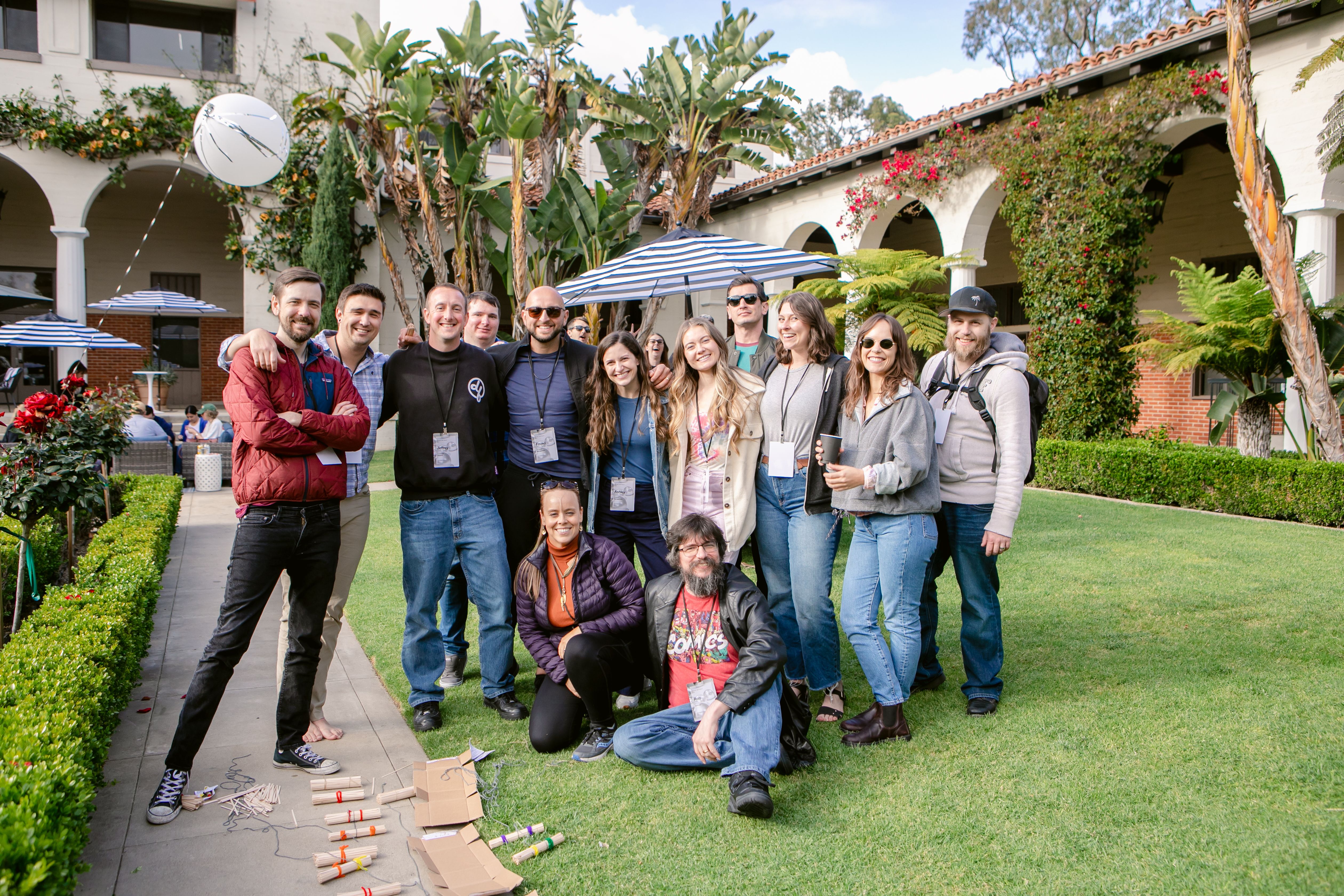 A woman sitting at a desk on a zoom meeting.