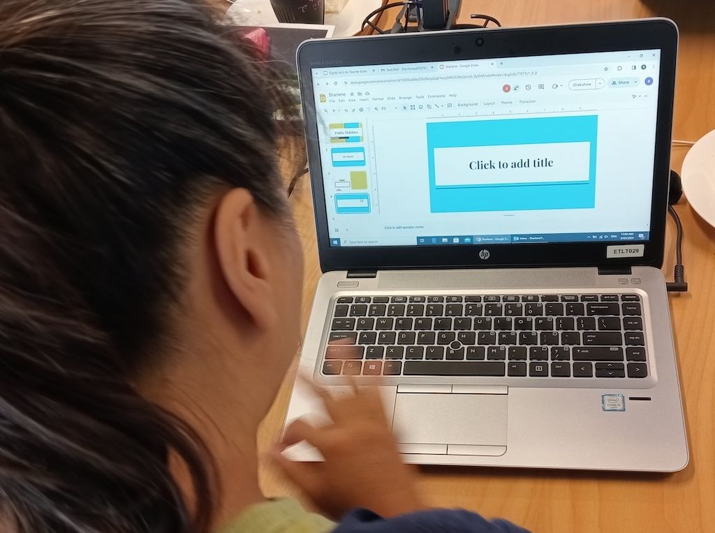 Teacher Aides working on computers